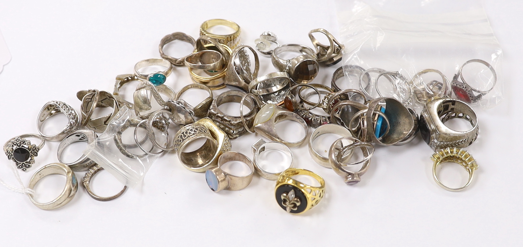 A quantity of assorted mainly white metal and 925 dress rings.